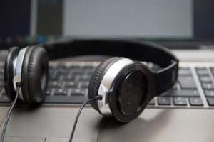 Headphones on laptop keyboard